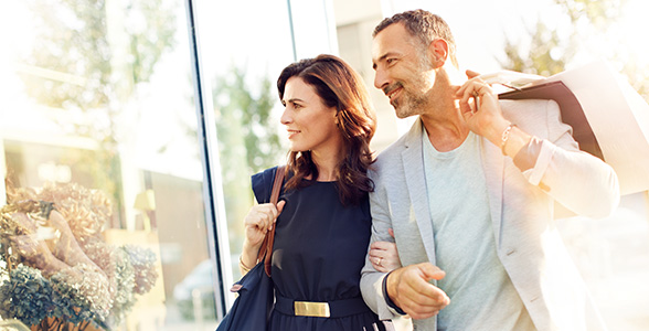 Investor couple window shopping